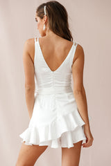 Wishful Thinking Plunging Neckline Ruffle Hem Romper White